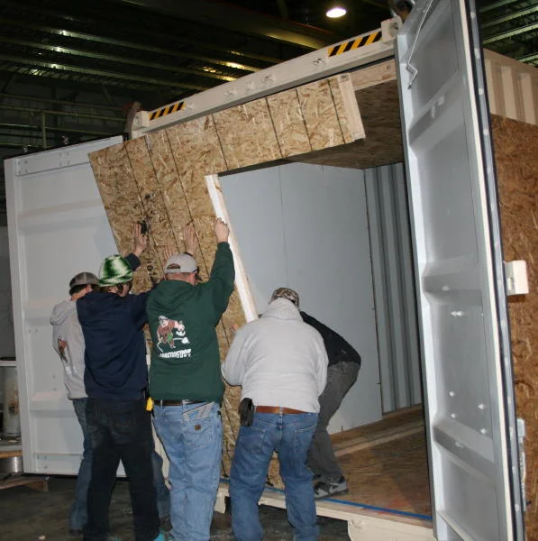  Photo Caption: Students from Highlands College assist in construction of MLI’s Mobile Maternal Surgical Unit
