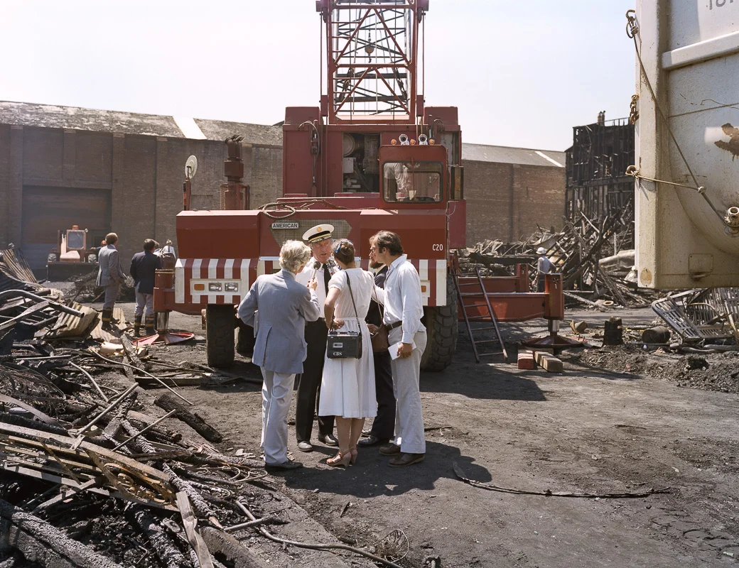 Fire Captain Andy Casper being interviewed after the July 10th five-alarm fire on Folsom Street, 1981