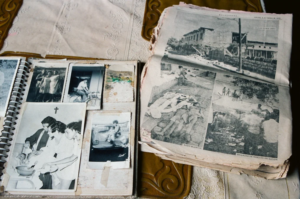 Family photo album with old newspaper clippings from the 1972 earthquake.