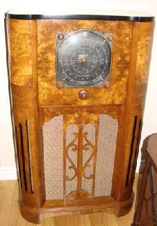 Pictured here is a fabulous 1937 Zenith 12U159. The next model up for 1937 was a 16 tube Stratosphere. The baby sister to the 12U159 is the 12U158 listed on my for sale page and now sold. The radio chassis for the 159 and 158 are the same. The 12U159 has a second 6 inch tweeter speaker. The 12U159 cabinet is made of 3 different book matched walnut veneers and has 3 inlays strips. The grille is very ornate in design. When I purchased the radio the wood cabinet was flawless. That is the wood had no damage, no chips, dings or marks to the wood of any kind. But the previous owner brushed a heavy coat of Varathane all over the original finish. Well it was a blessing in disguise. This finish protected the cabinet. I stripped this finish off to the bare wood and refinished it's to it's original look.