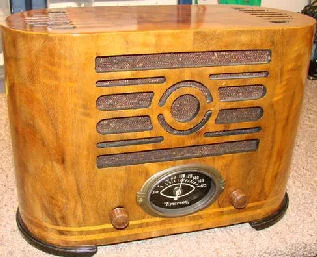 This is a 1937 Emerson model J106. The cabinet was manufactured my Ingraham. Wood cabinets made by E.Ingraham Co. like this radio are considered collectible in themselves. Ingraham's level of design and craftsmanship, their ability to contour wood panels was unequaled to others. Ingraham cabinet radios are among the highest valued.