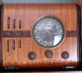 A favorite of small case radio collectors, a 1938 Zenith model 5S218. Commonly called a "Cube Radio". Zenith made a bunch of models in the shape of a square cube. The 5S218 is one of the smallest of the cube models.