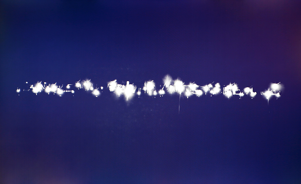 Laser cutter as a tool for interruption: In some ways, text is an artifact of language, so I chose to explore what artifacts could be made from type and see how those artifacts operate in a similar context. The image above is a long exposure shot of the laser while cutting "Handle the driver units carefully"