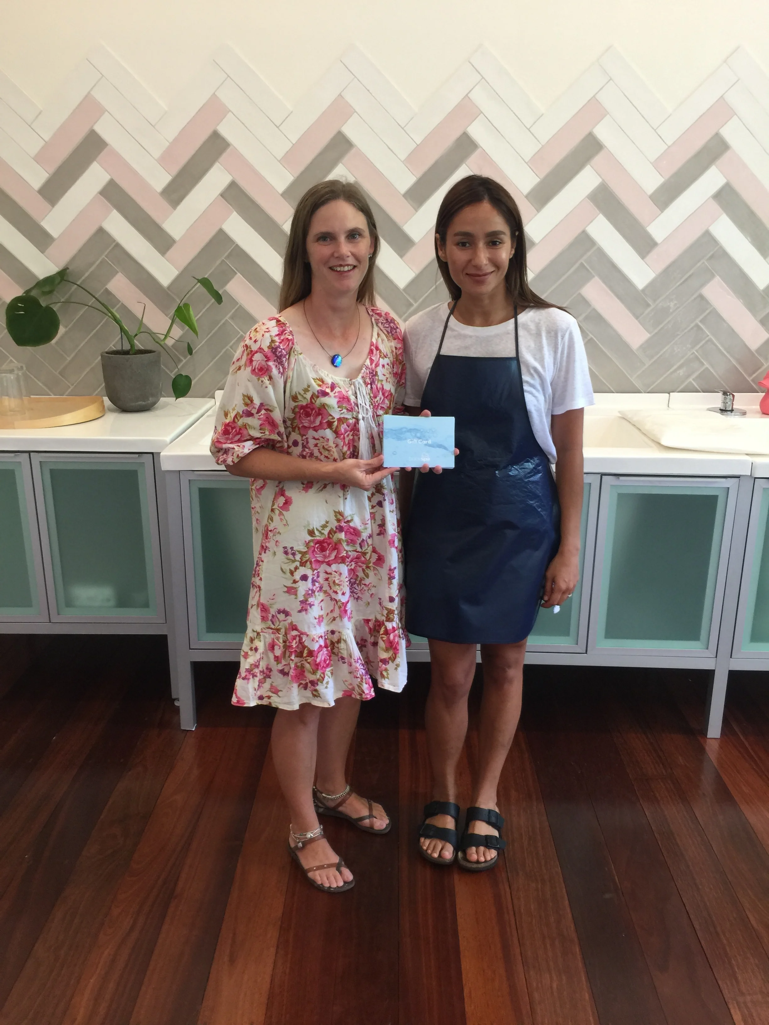 Chairperson Amber with Director Anita collecting the gift vouchers.