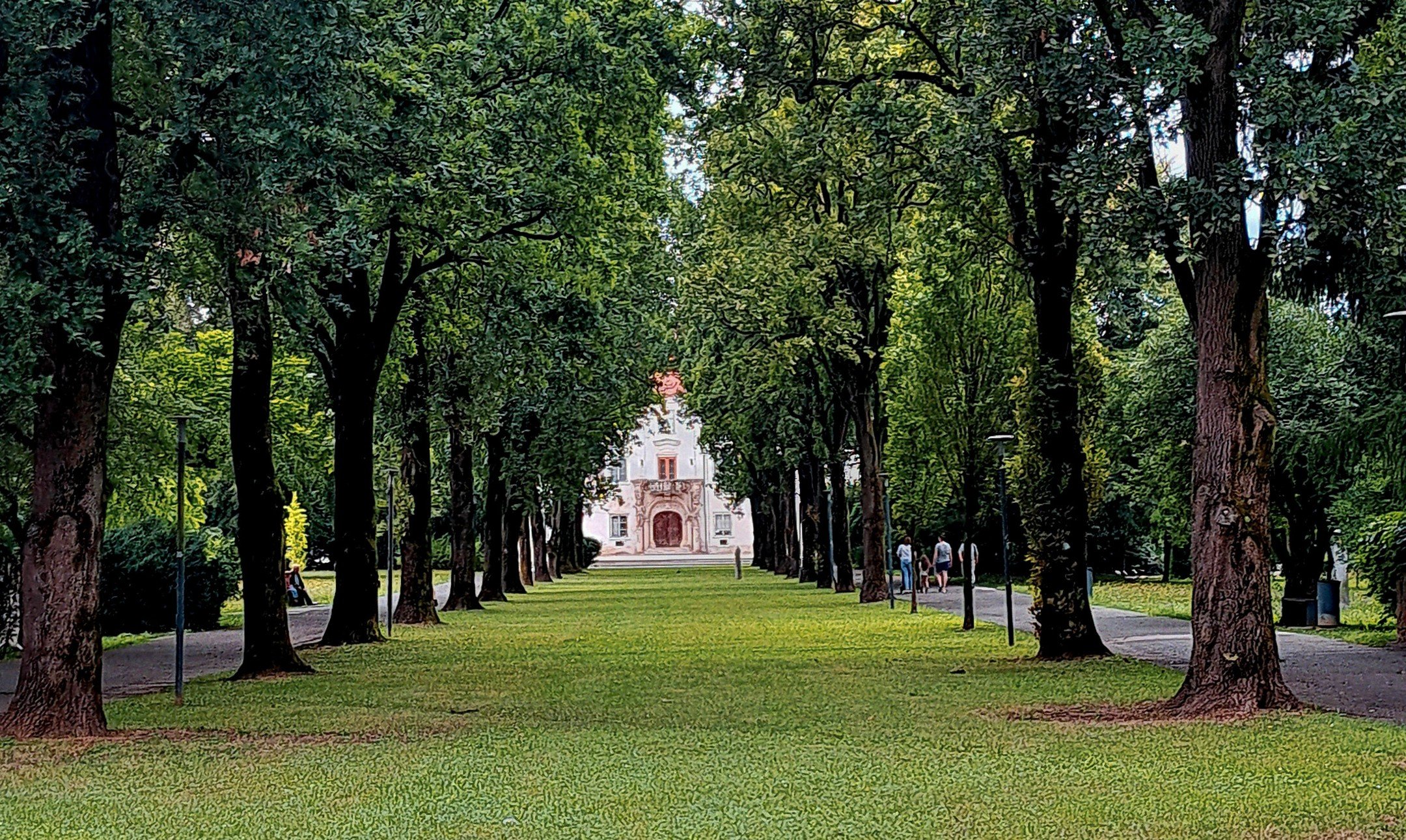 A long, quiet axis of trees leading the eye straight to Soboski Grad, in Murska Sobota.

Shot on Fujifilm Superia X-TRA 800, where greens feel alive rather than tidy, and contrast has a slightly wild edge. The grain gently hums in the background, the