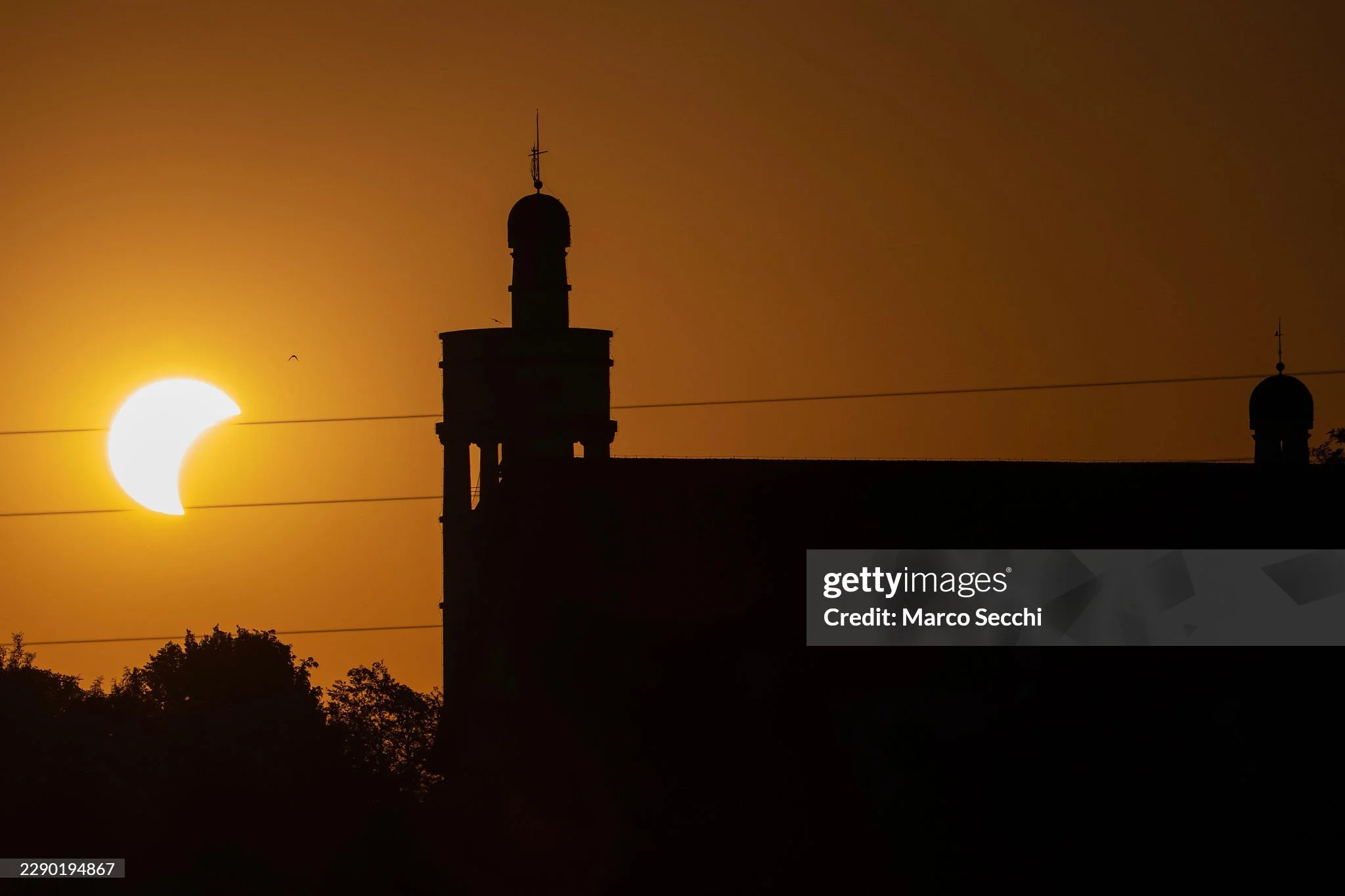Few frames now on Getty Images from last week partial solar eclipse seen alongside the Church of the Ascension of Christ in Bogojina, Slovenia. 

The landmark church was designed by renowned Slovenian architect Jože Plečnik and built in the 1920s, in