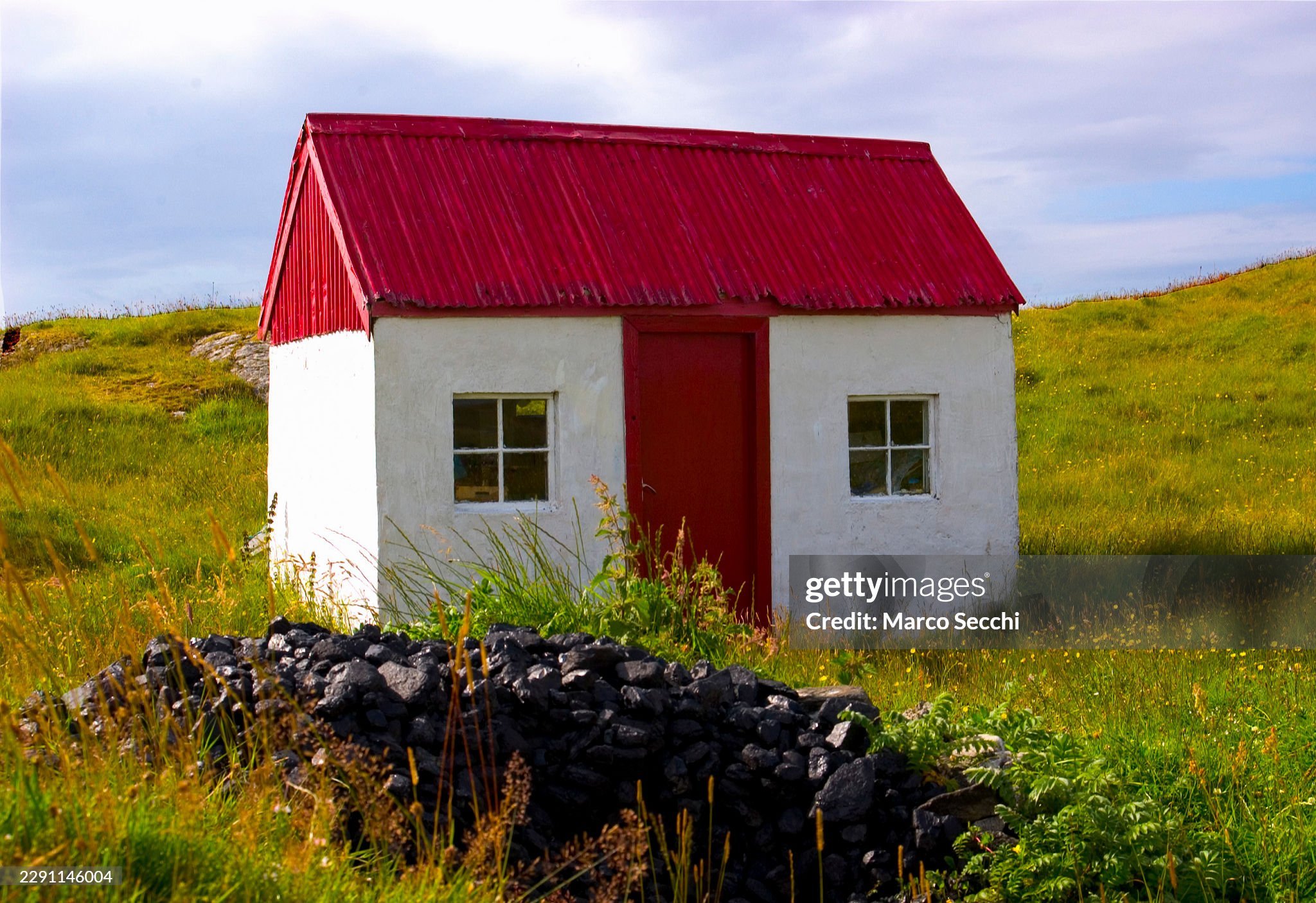 On Scalpay, they used to say that this little coal house was never entirely empty.

Even at the end of the hardest winter, when the last piece of peat had been carried indoors and the fire had almost surrendered to the Atlantic wind, something could 