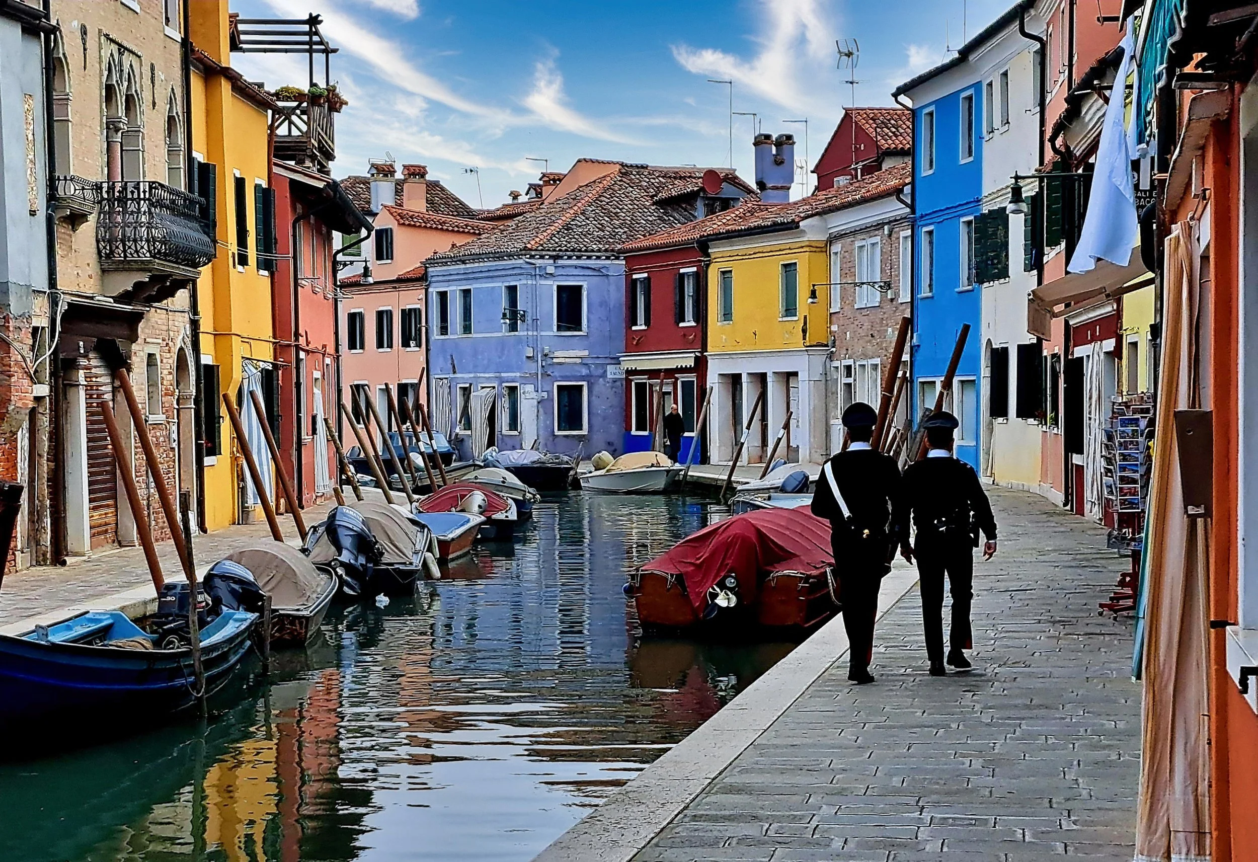 Two carabinieri, a canal full of moored boats, Burano's colours doing all the talking.

This is the pace of the Venice workshop. Quiet corners, real life still moving through them.

Check my Workshops and masterclasses in Venice
 
#Venice #Burano #St