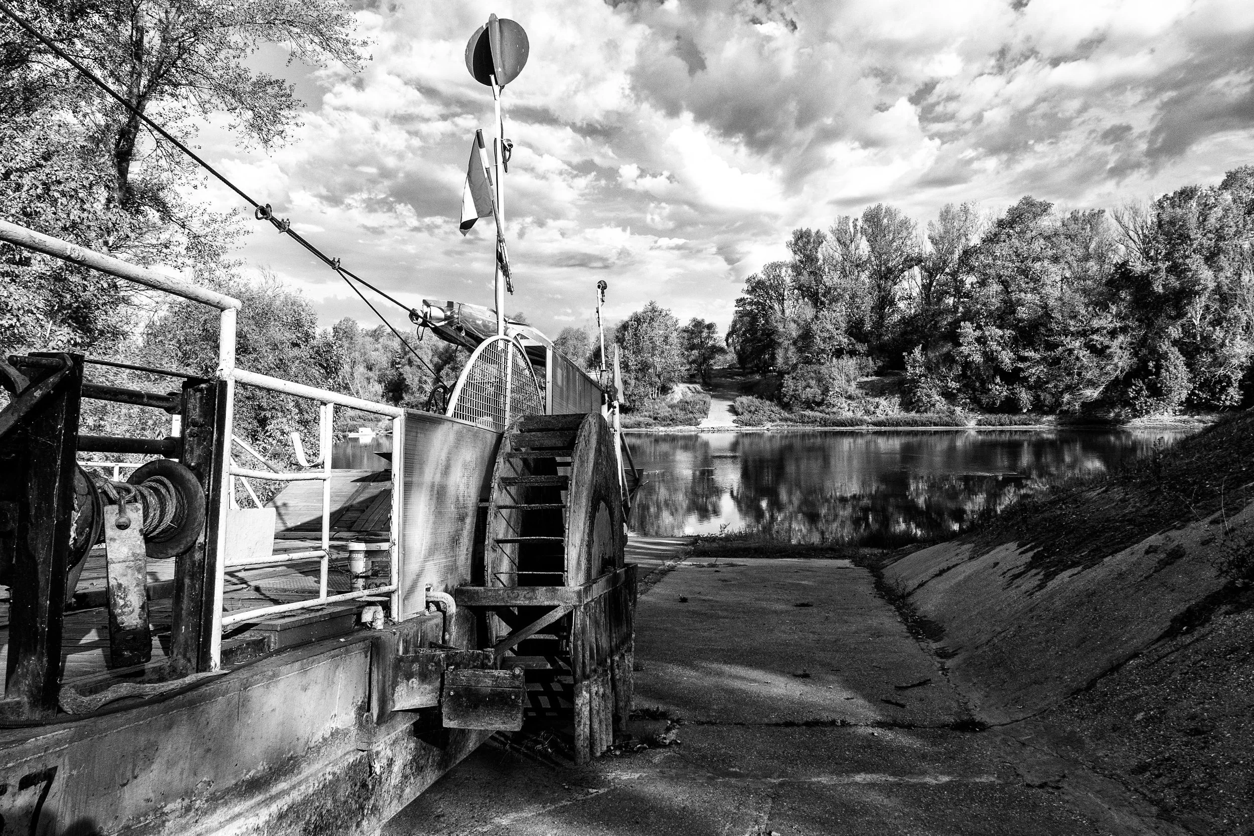 Nagyr&eacute;v begins with a crossing.

The Hungarian word r&eacute;v means a ferry or river crossing, and the first surviving written mention of one here dates to 1311. In this frame, the machinery, cables and ramp occupy one bank of the Tisza, whil