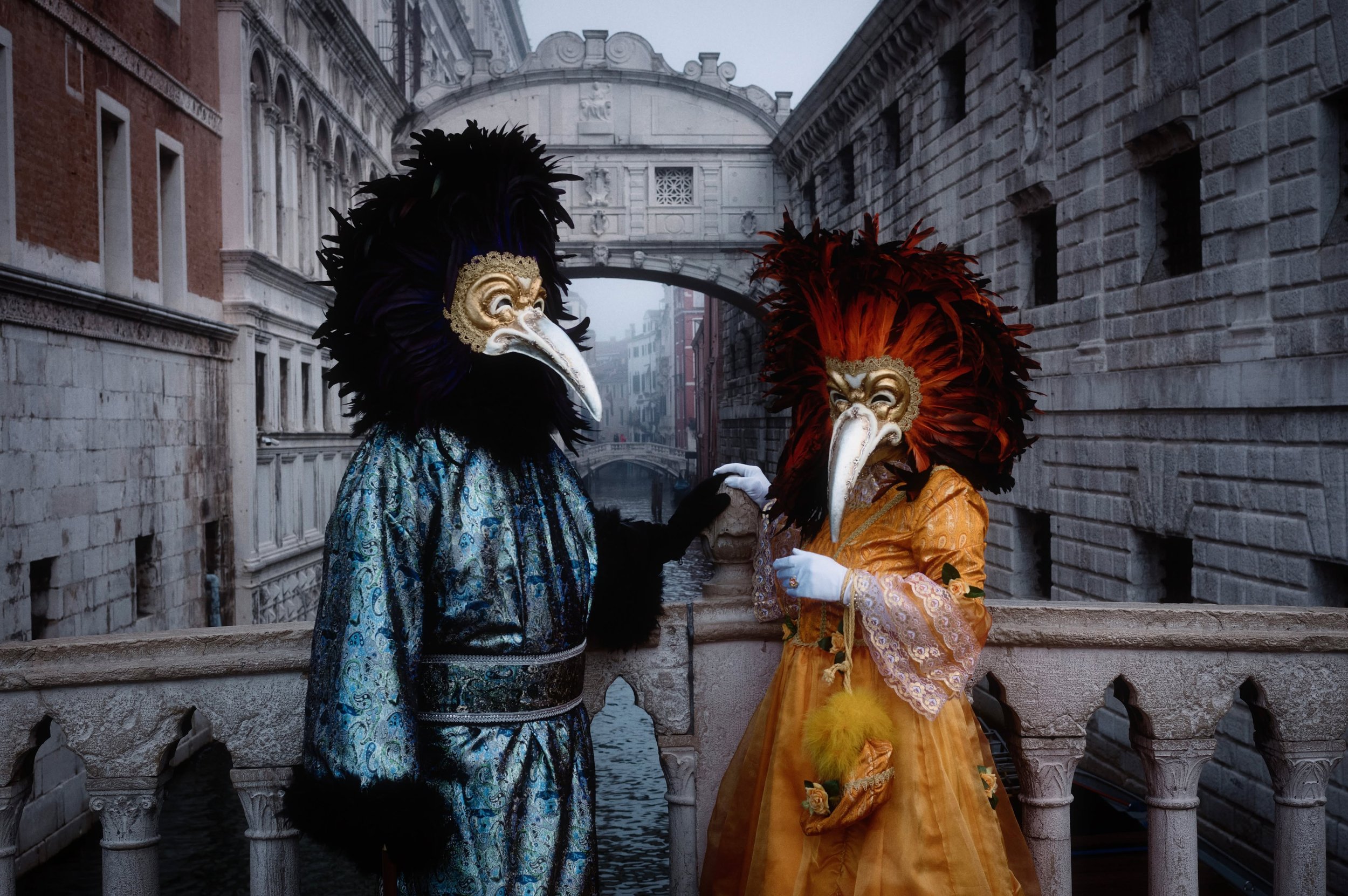 Venice Carnival is colourful, but I like what happens when you put those colours against the city&rsquo;s winter greys.

Here, the blue and gold fabrics stand out against the stone, while the Bridge of Sighs gives the scene its unmistakable setting. 