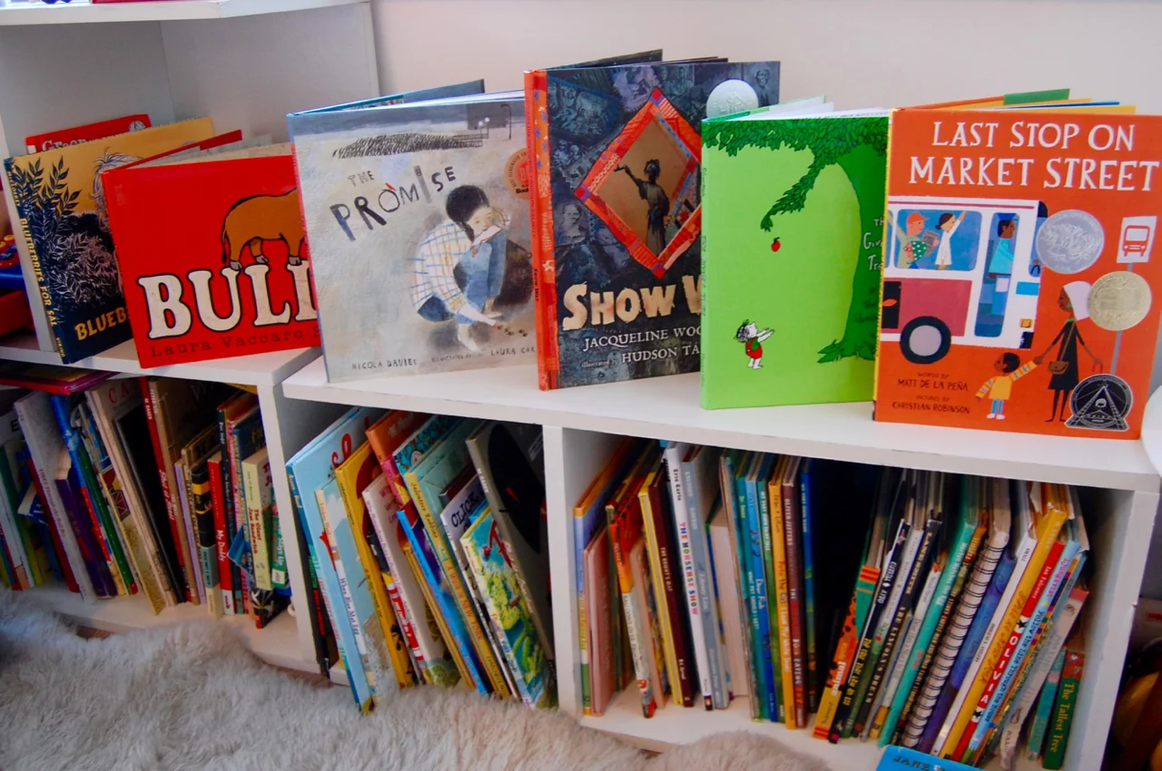 our modular bookshelves are from way basics and the sheepskin rug is from dwell studio .