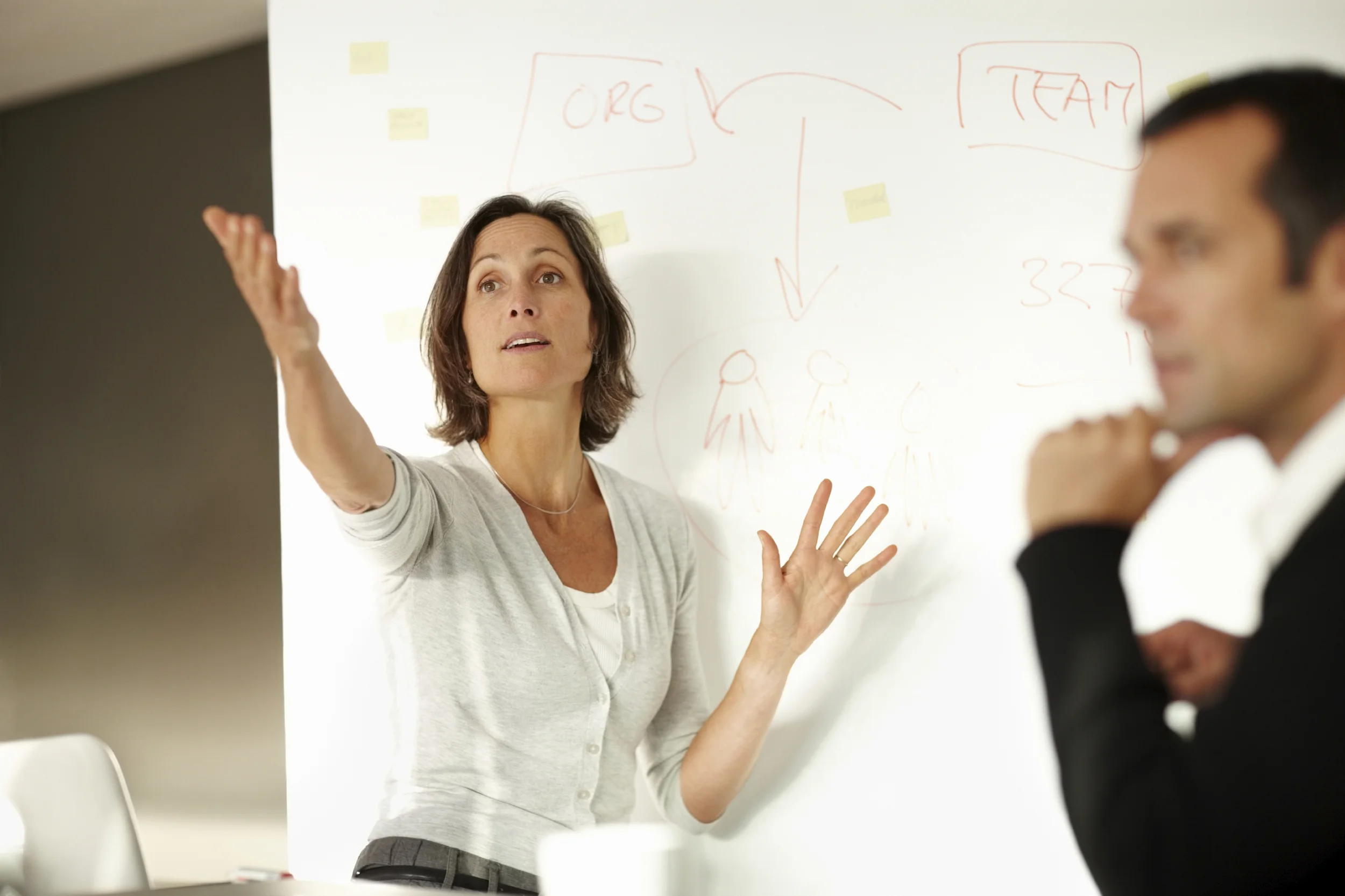 Smart businesswoman answering the query during a presentation.jpg