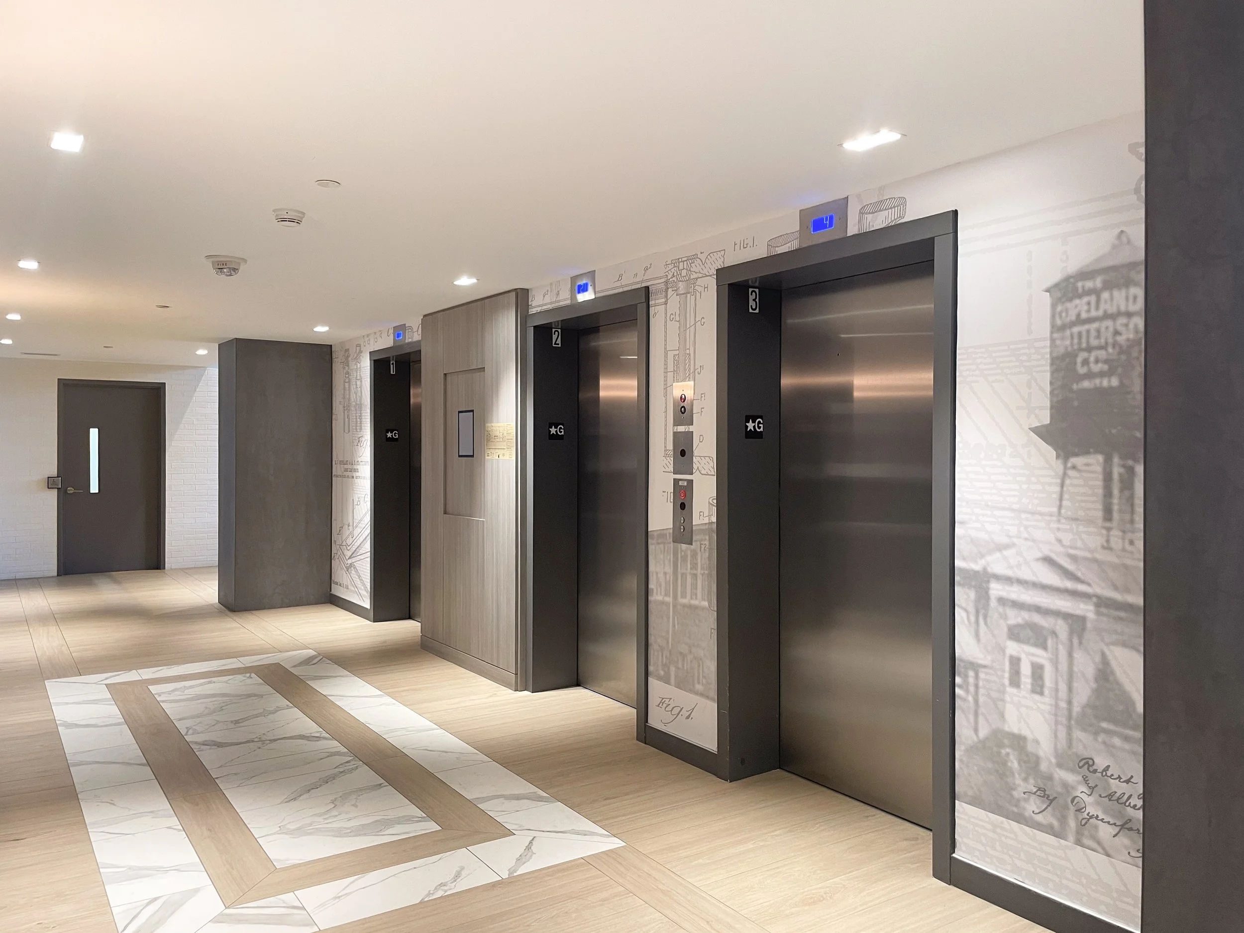 Railroad Condo Elevator Lobby with Wall Graphic by Studio 8 Design