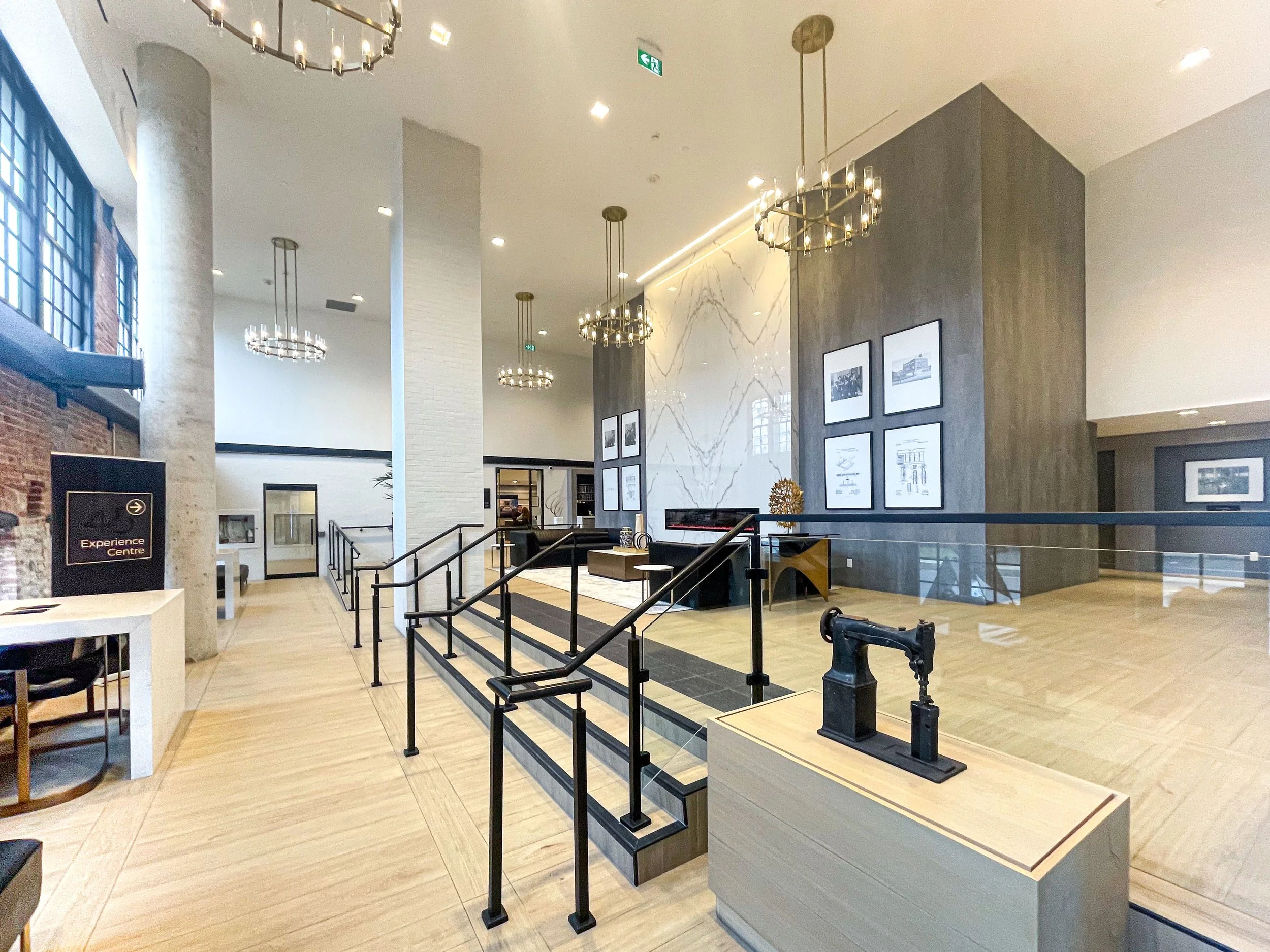 Completed Condo Lobby with Lounge and Fireplace by Studio 8 Design