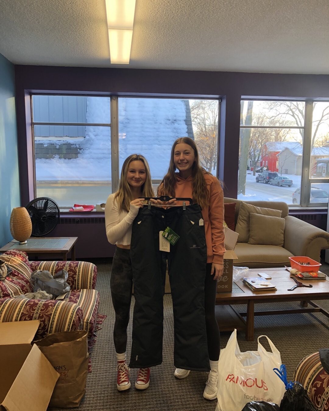Our high school volunteers found a few pairs of snow pants in our donations last night. Thanks to the person who donated them, and thanks to Katie and Kate!
