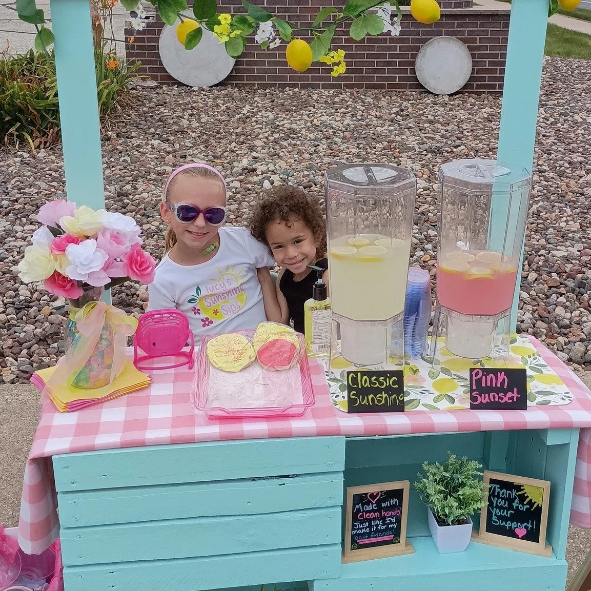 Blessings to all students and staff who start school this week! Speaking of starting school: Here's a pic of one of our young members and friend, selling lemonade and cookies to raise money in order to buy new school backpacks for youth going back to