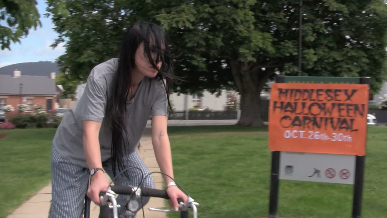 Ensurance Trap, 2019 (still) Video in collaboration with Kris Savic (3.42 mins) Music in collaboration with Elmo Aoyama Desire Lines Walking Tour, Hobiennale, Hobart. Curated by Maeve Parker and Seb Henry-Jones