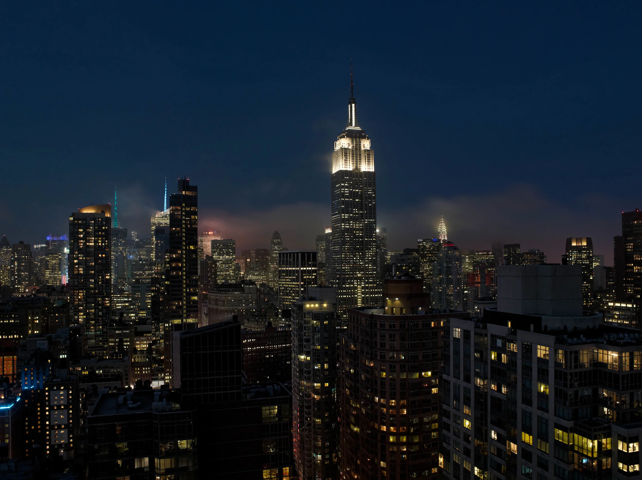 Rooftop view of midtown Manhattan and Empire State Building | Photo by Karsten Staiger