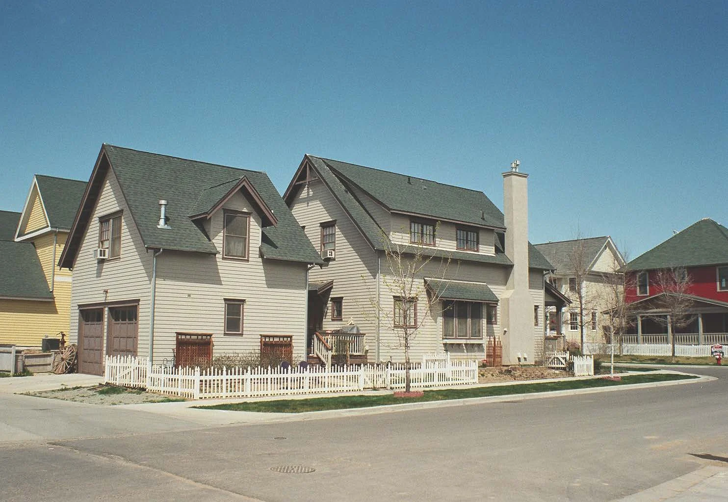 Main house to the right, carriage house to the left.