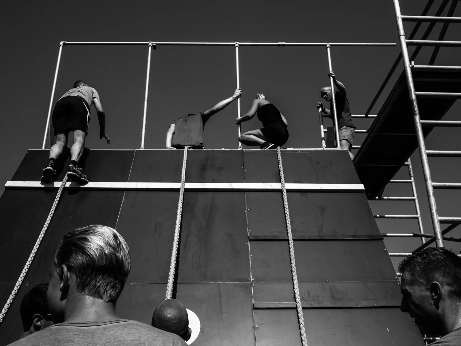 zwolle AUGUST 2016 Shot taken during the Obstaclerun in Zwolle at the "Milligerplas" just near my house. The participants are running on a 9 km track and find 8 obstacles they have to take. Here they climb on a slide where they jump into the harbor of the Milligerplas. Shot with Olympus OMD5 Mark 2 and Olympus 17 mm f/1.8