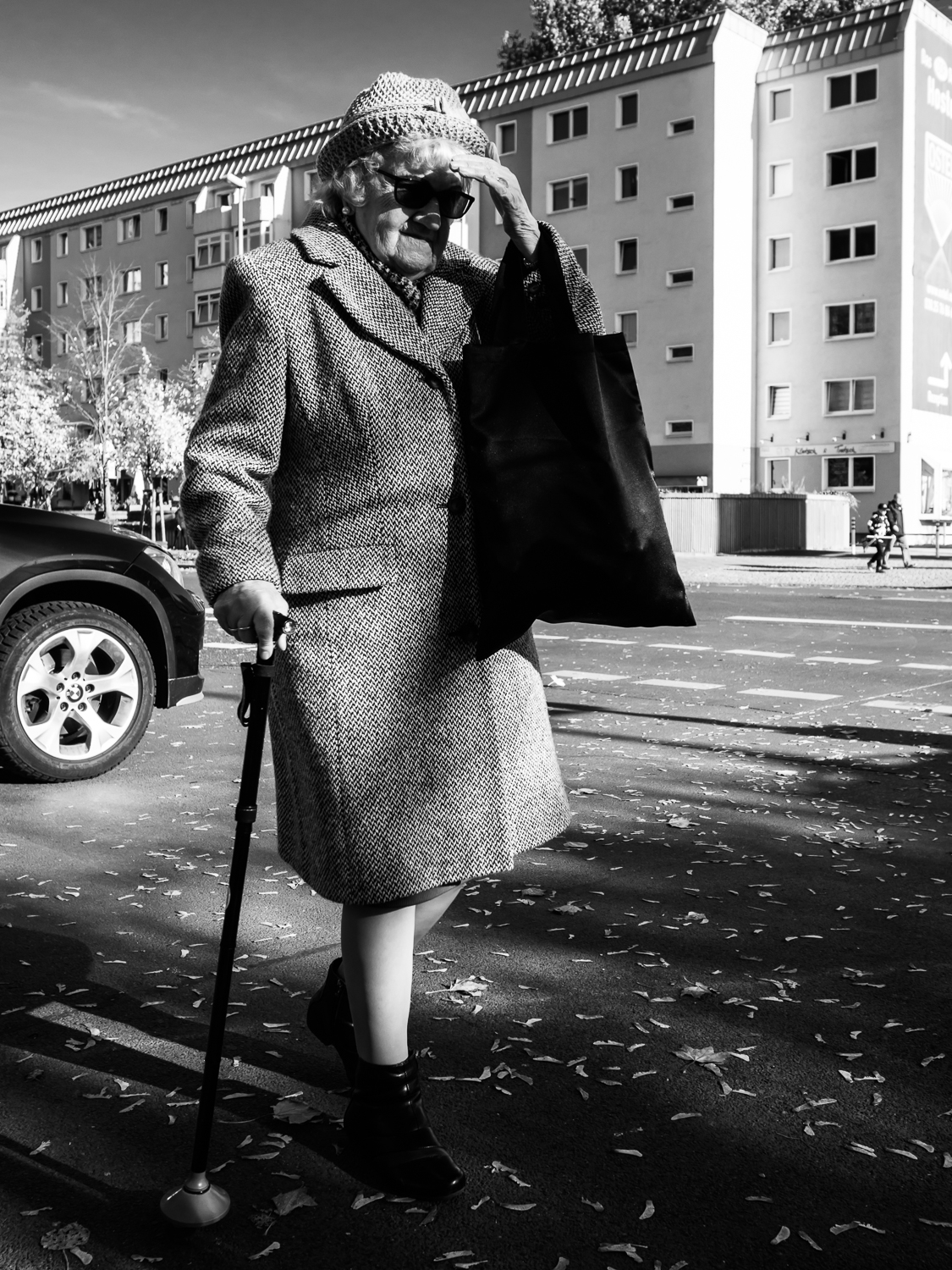 Shot taken in Berlin. I saw this lady when I walked around in Berlin. She was moving quite slow and I took some photos of her. I am not sure if she saw me or that she just didn't bother. Shot with Olympus OMD5 Mark 2 and Olympus 17mm f/1.8