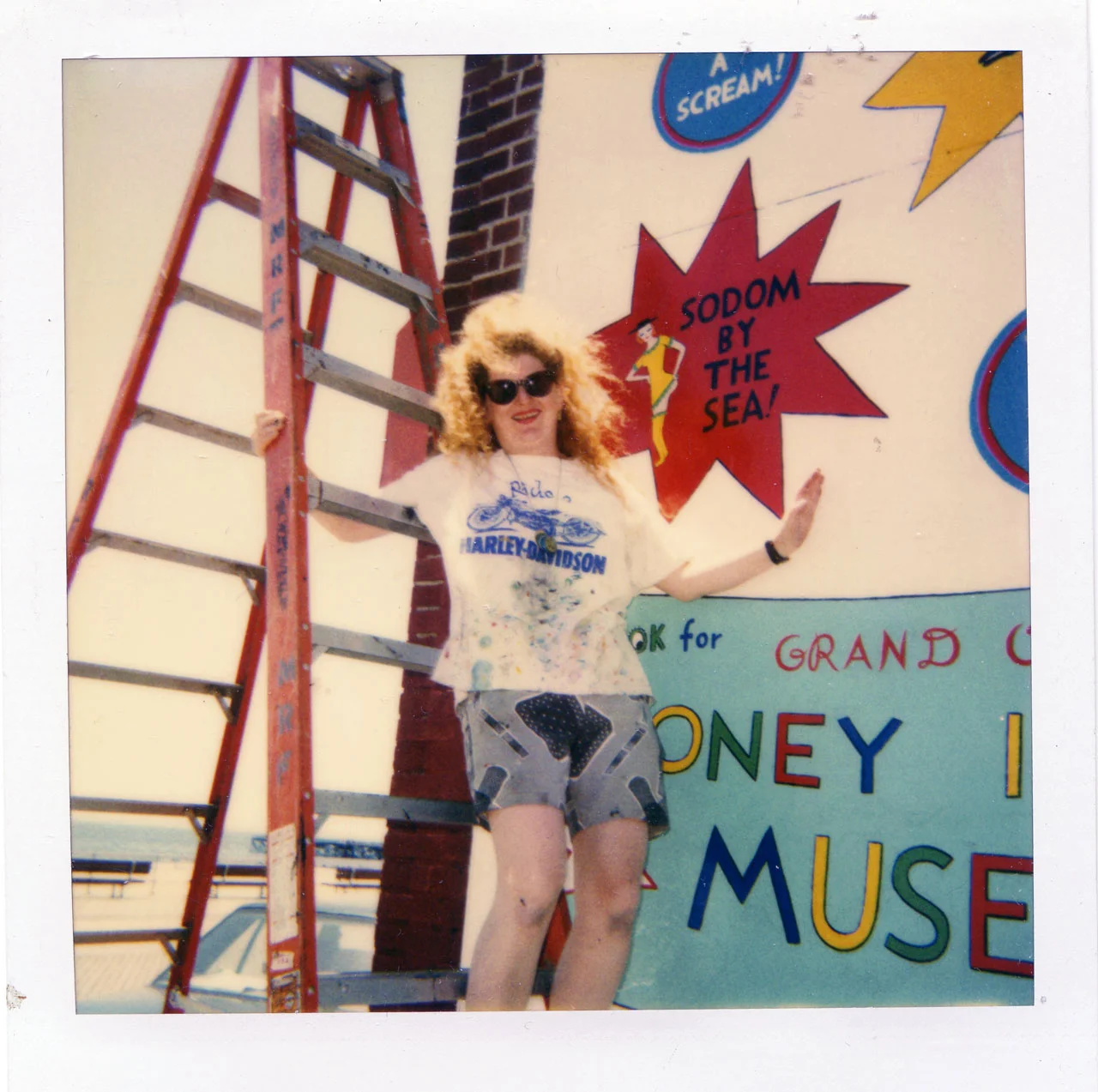 Artist Julie Wilson painting a Coney Island mural.