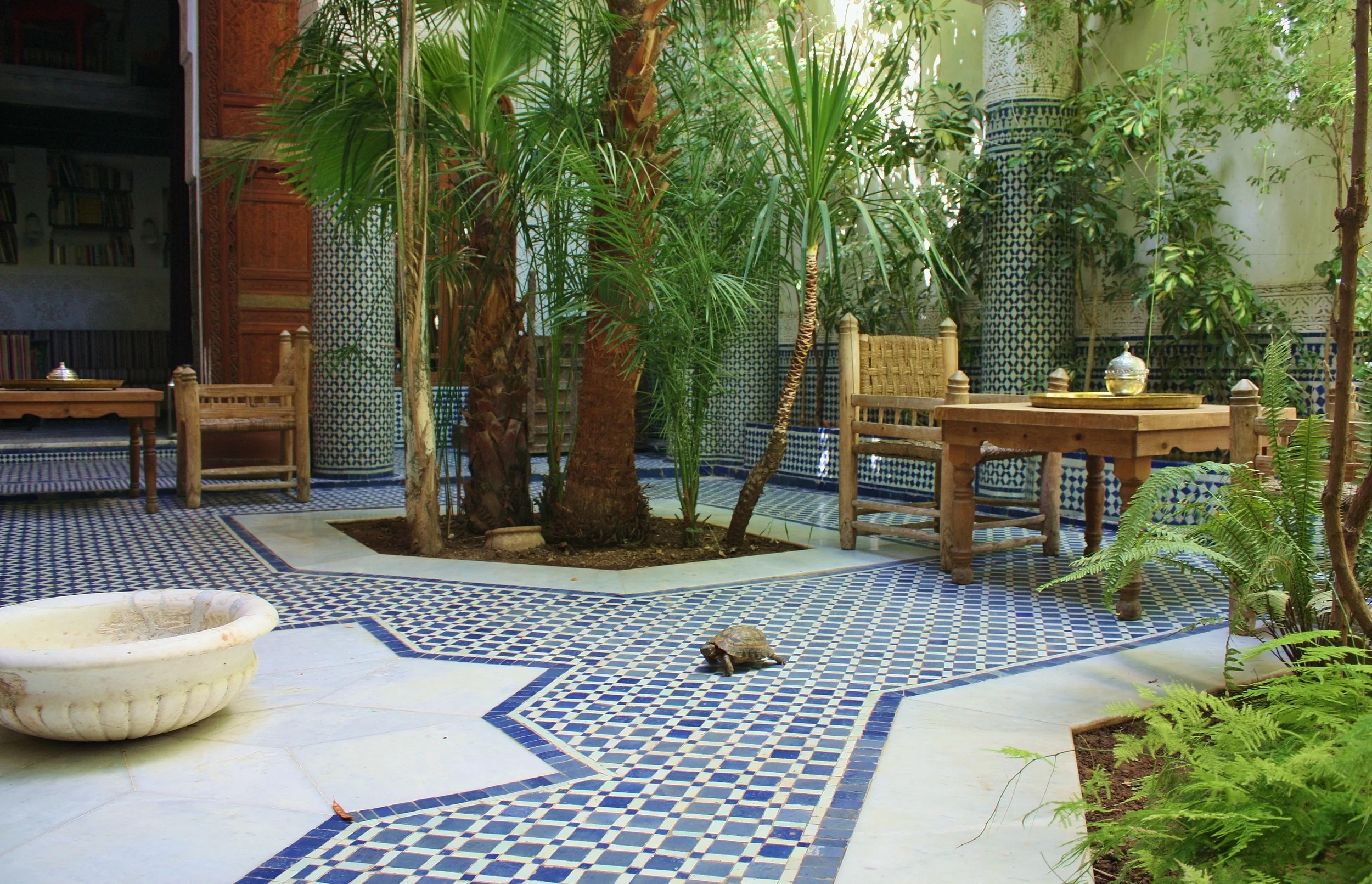 My private oasis: riad courtyard in the old city of Fez in Morocco. Most riads abound with fountains and luxurious textures of tile-work and and hand-carved wood and plaster arts.