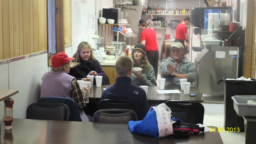 Guests and their tour guide enjoy a leisurely meal at Deadhorse Camp