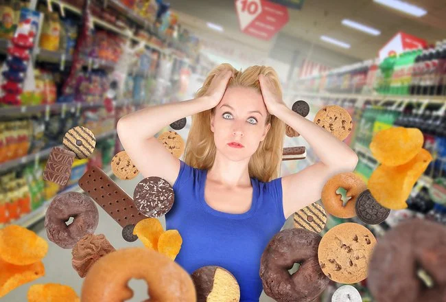 woman with floating junk food 650 X 400.jpg