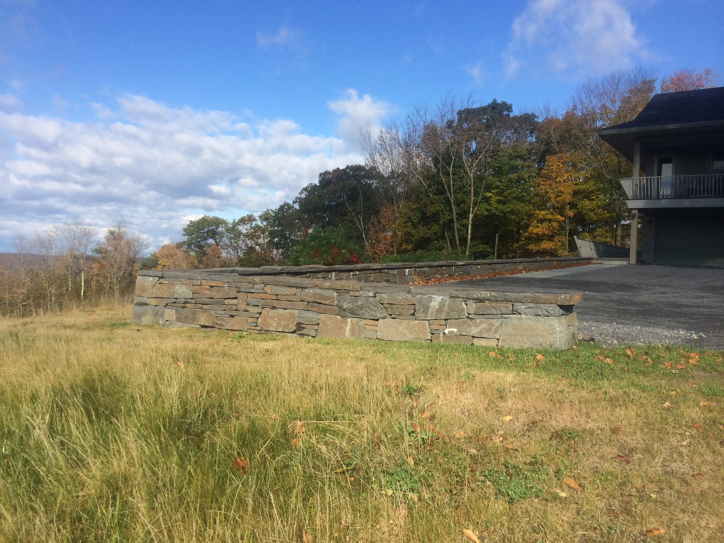 Parking court wall of quarry stone