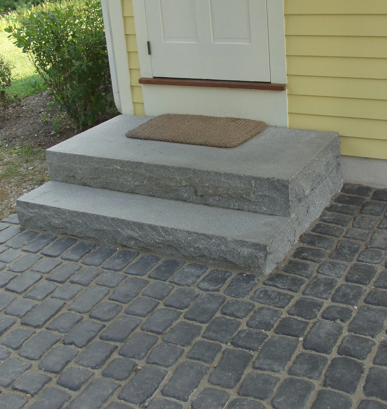 Granite steps and cobble paving