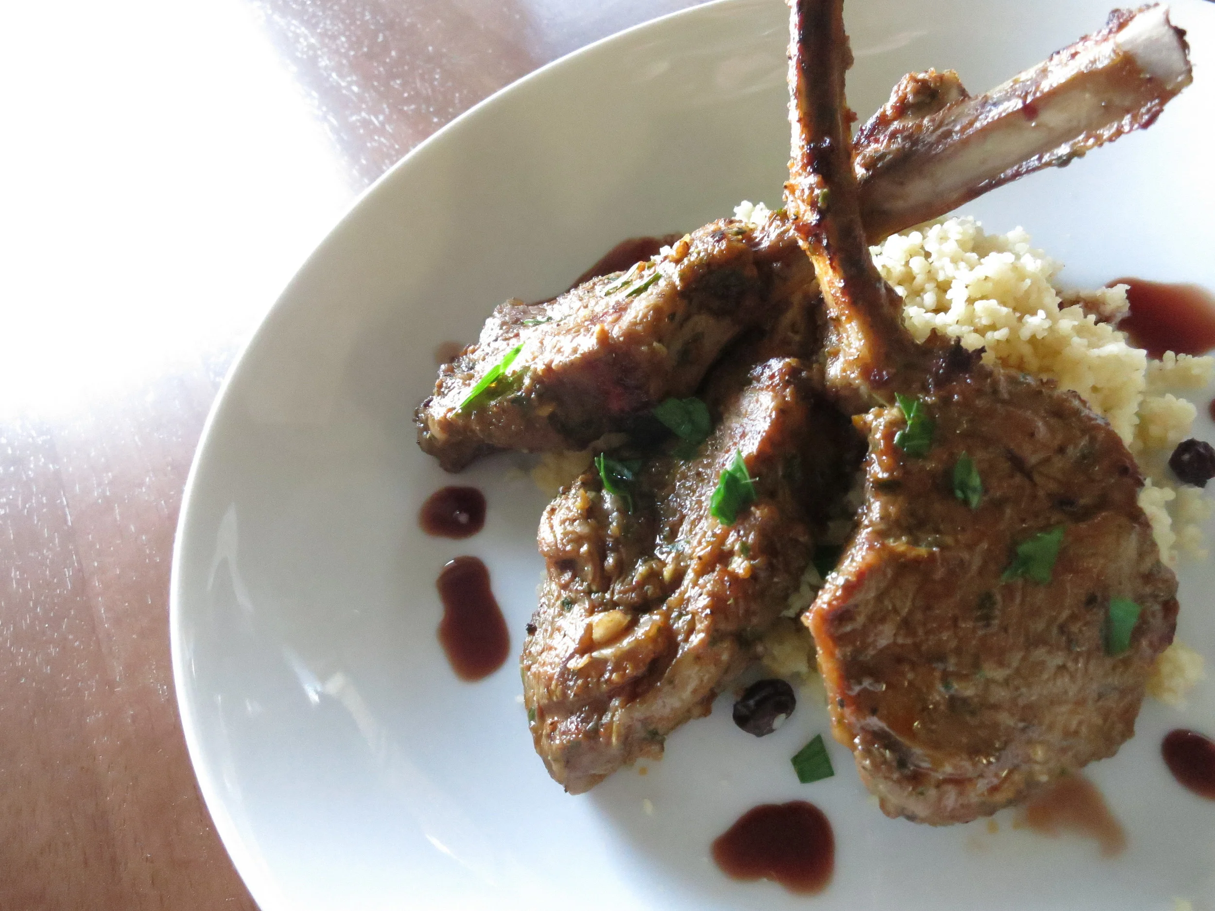 Spice marinated Lamb chop with Meyer Lemon and Currant cous cous