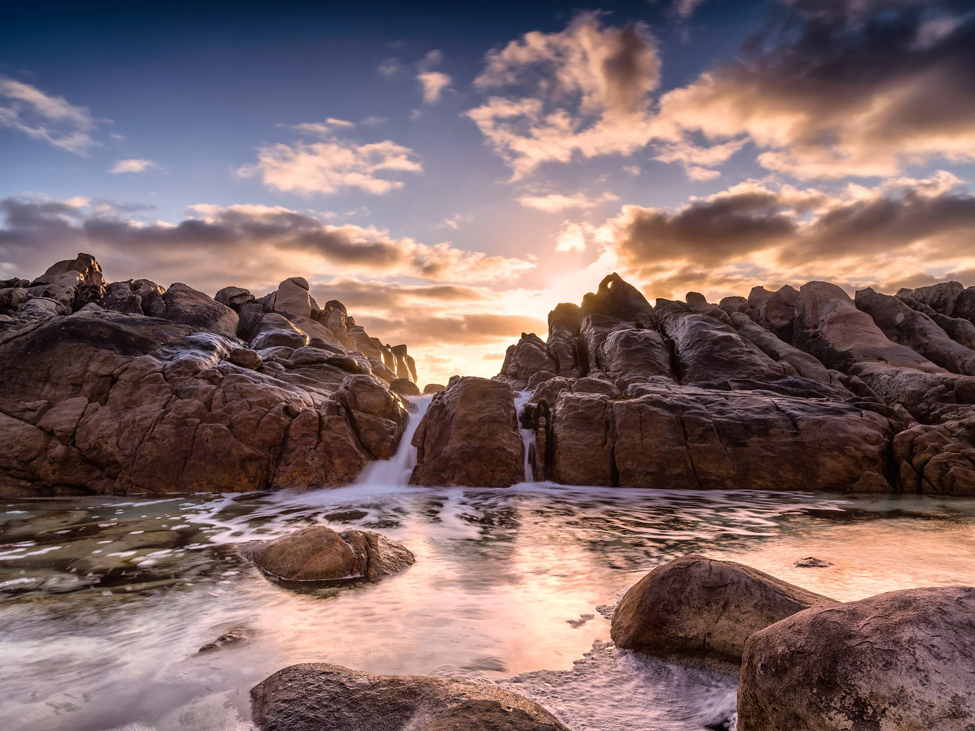 Striking sunset image of wyadup rocks wave pool.