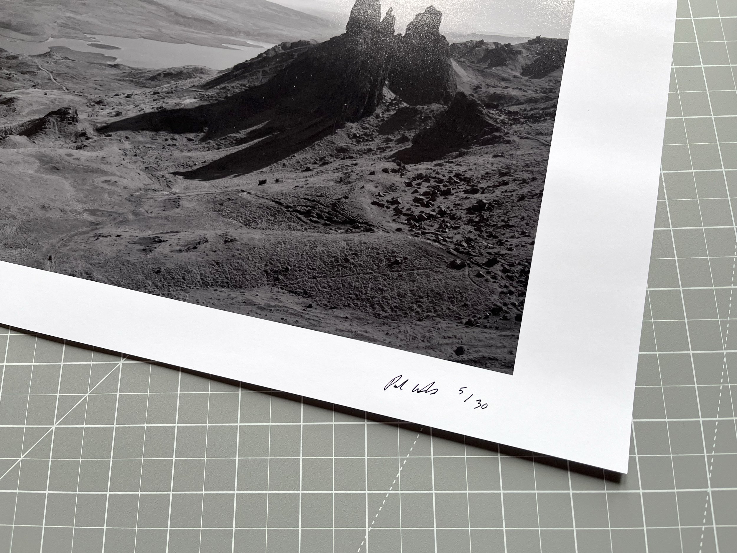Black and white photograph of a mountainous landscape with rugged terrain, rocky formations, and a valley, with handwritten text at the bottom reading "Pale Alto 5/30."