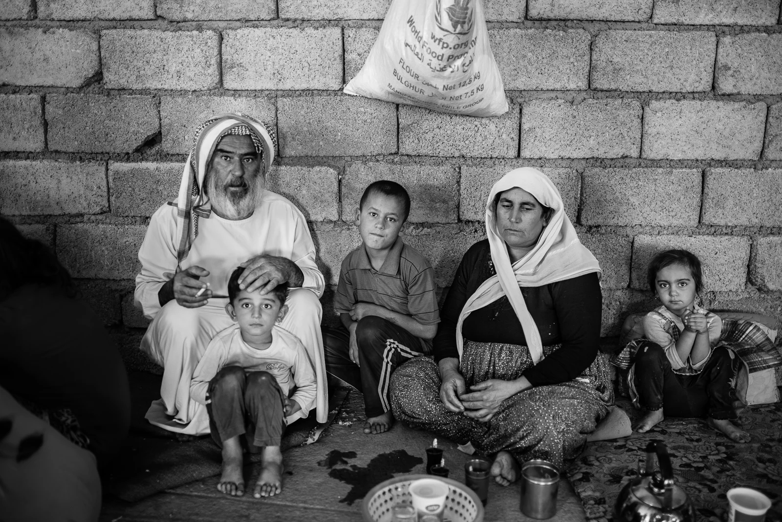 Family, building under construction in Zakho