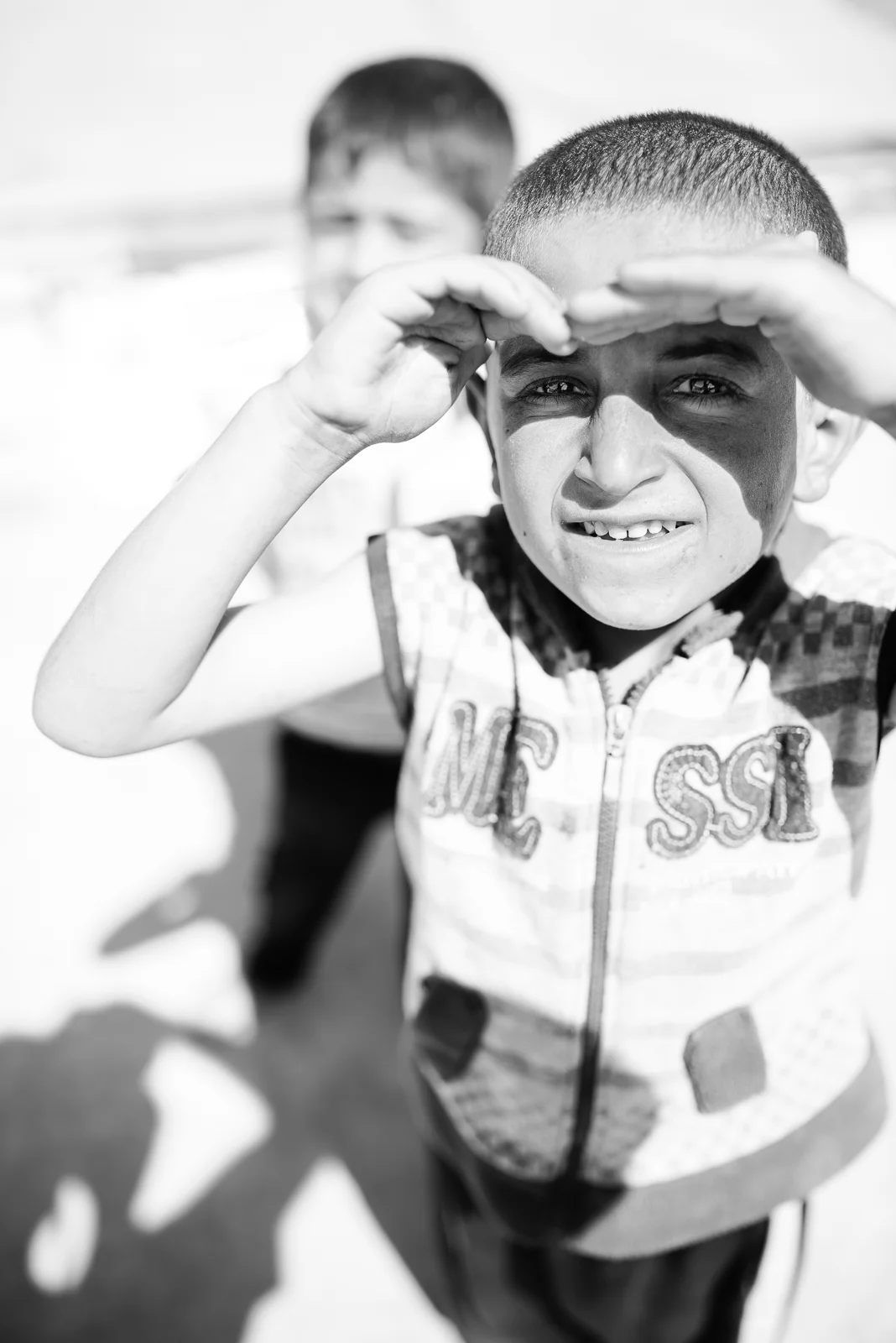 Children under the sun in a small refugees camp in Erbil
