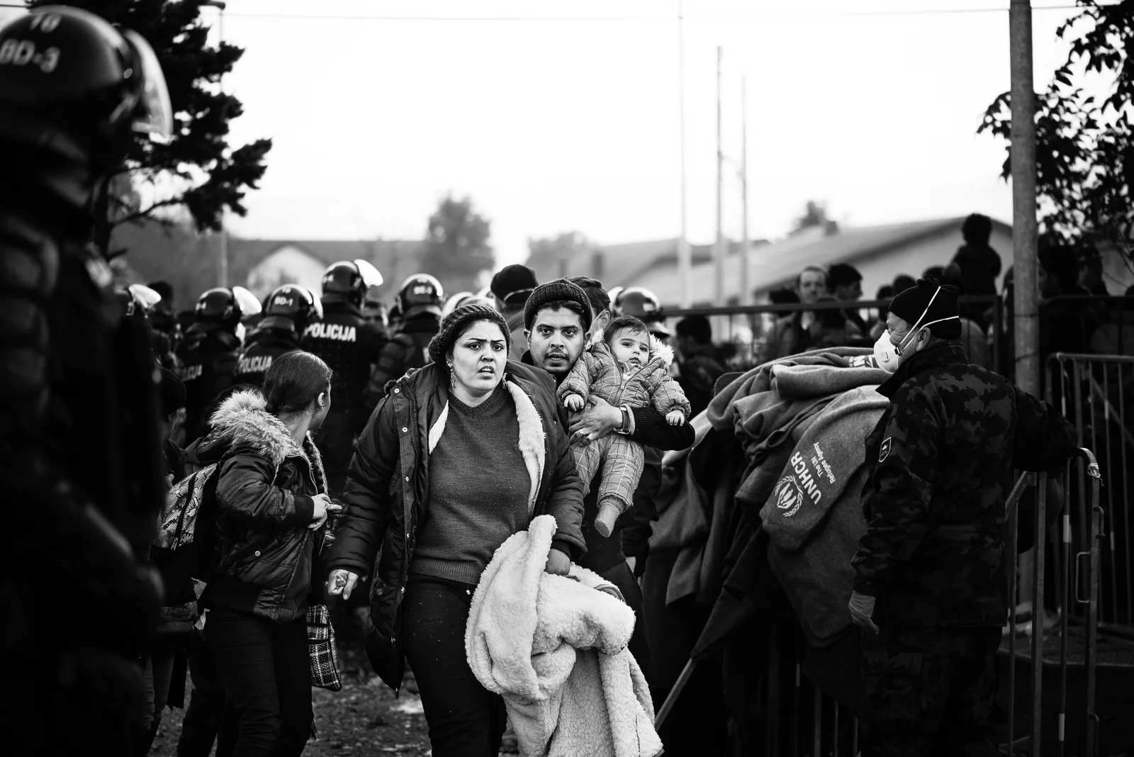 A family of migrants while they are transferring to train station in order to go to Austrian border