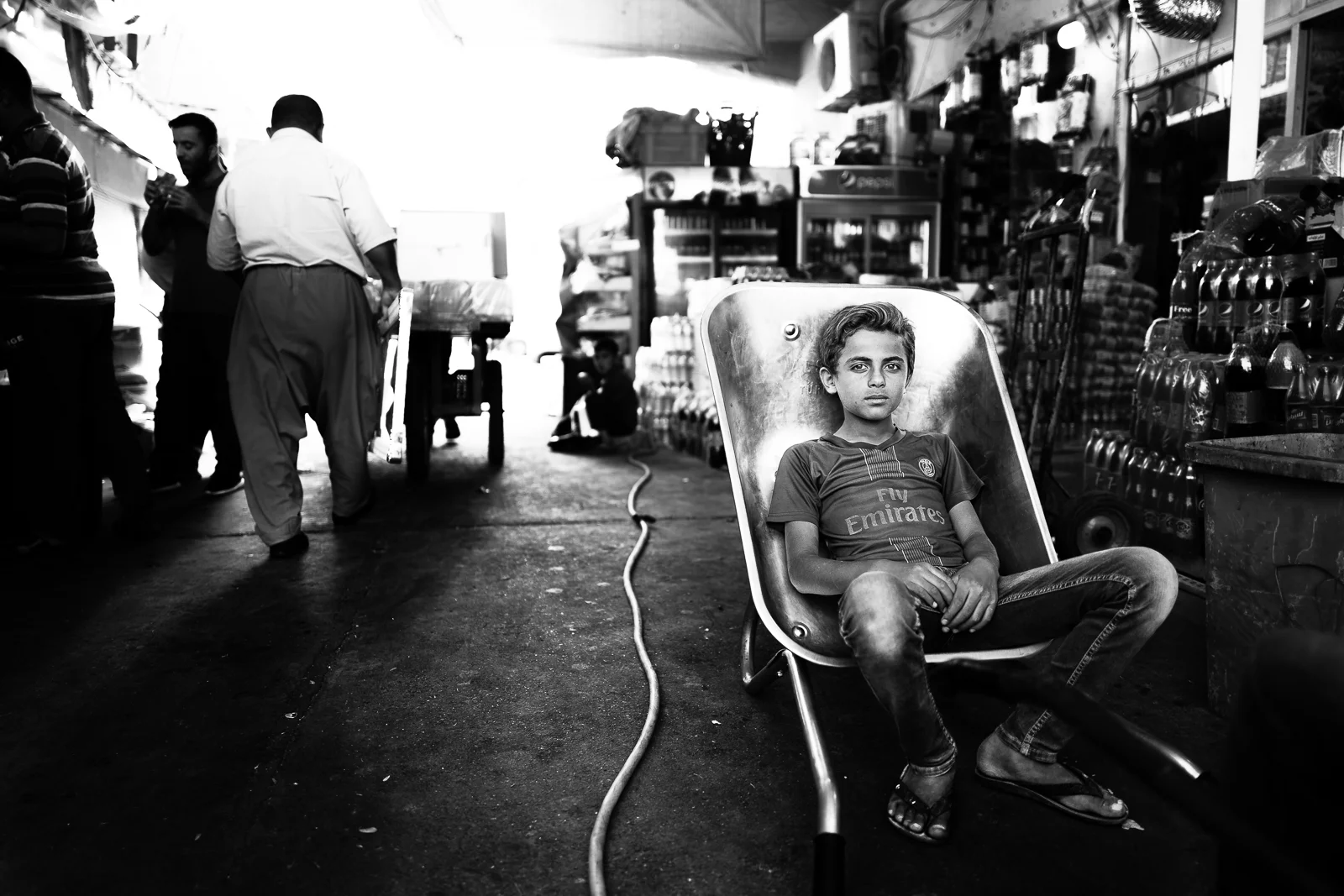 Child is taking is rest in his cart at the Erbil bazaar
