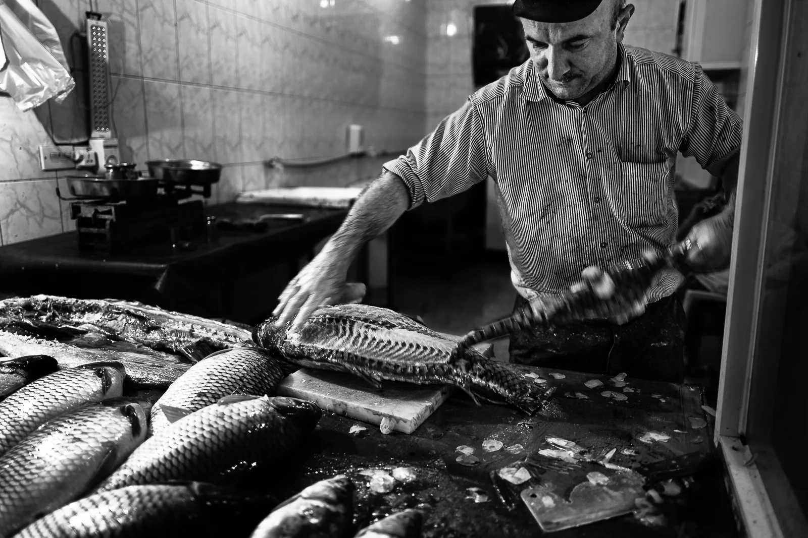 Fish seller in the Douhk meal bazaar