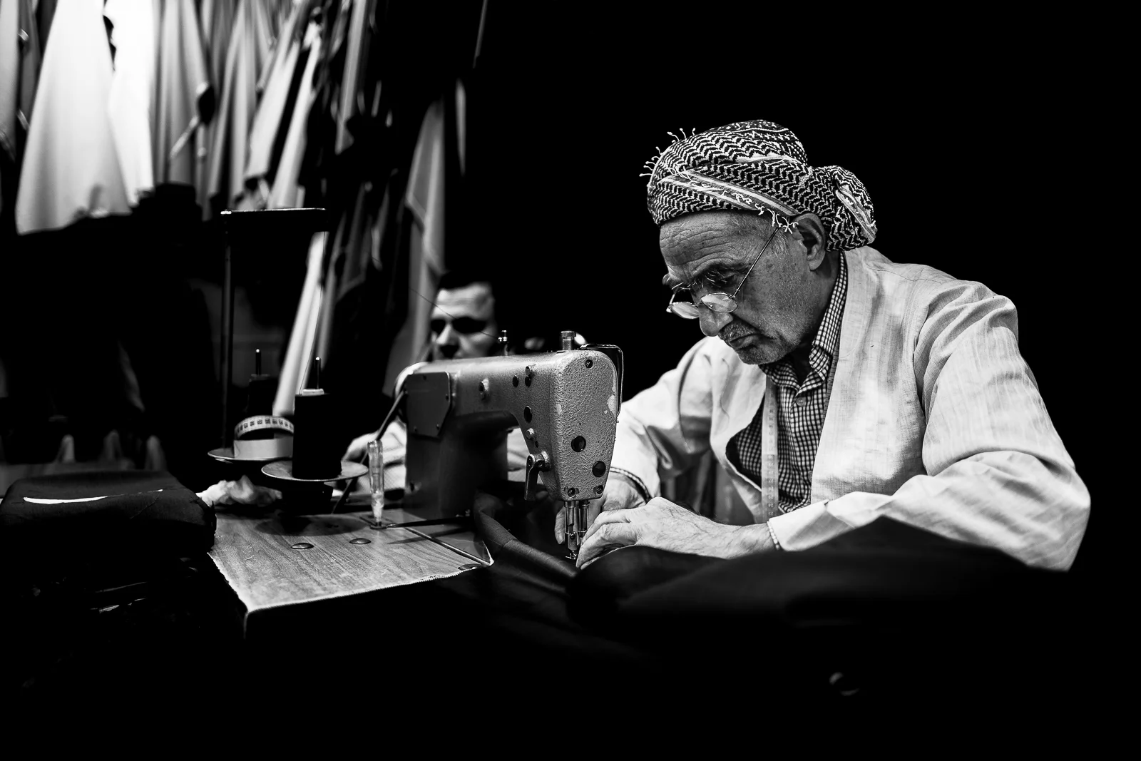 A tailor inside the Erbil bazaar