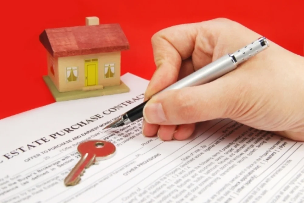stock-photo-25894423-property-and-mortgage-deeds-sit-on-top-of-plans.jpg