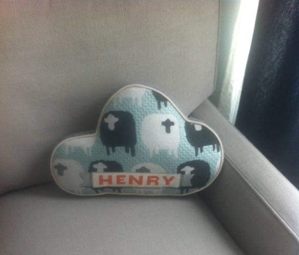 Pillow drawn by my sister after this mobile , needlepointed by me, finished by an expert!