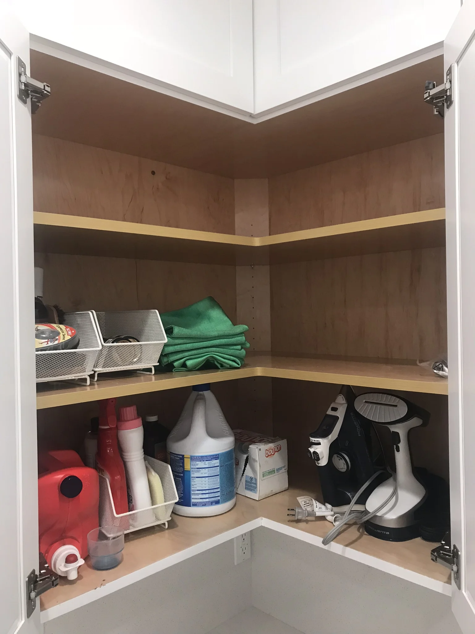 This is our laundry cabinet - everything we need, nothing we don't, and space if needs change. The cabinets above are empty, too!