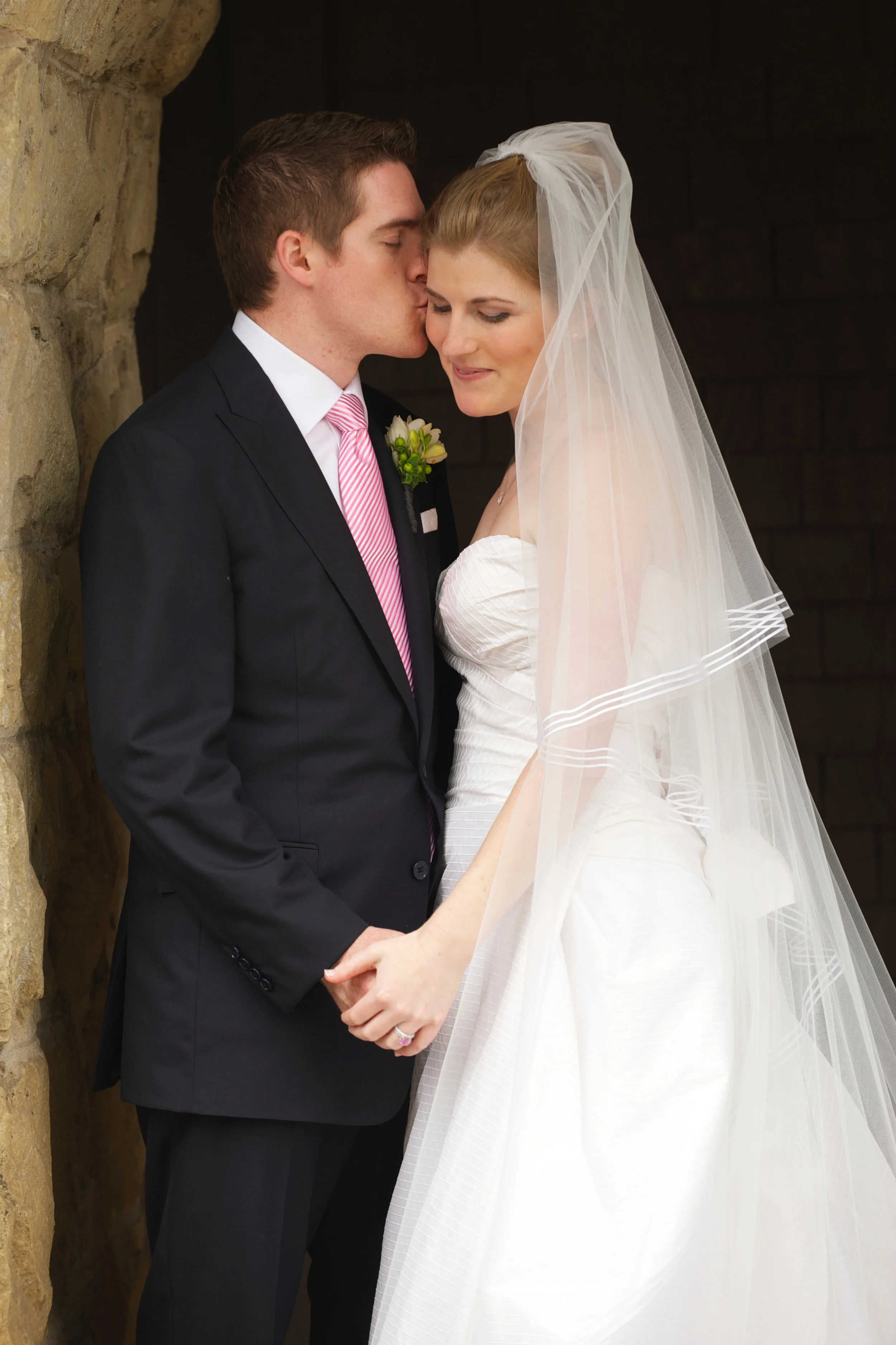 This one's framed in my living room. Dress and veil by Peter Langner via Marina Morrison , suit by Ralph Lauren , tie by Thomas Pink .