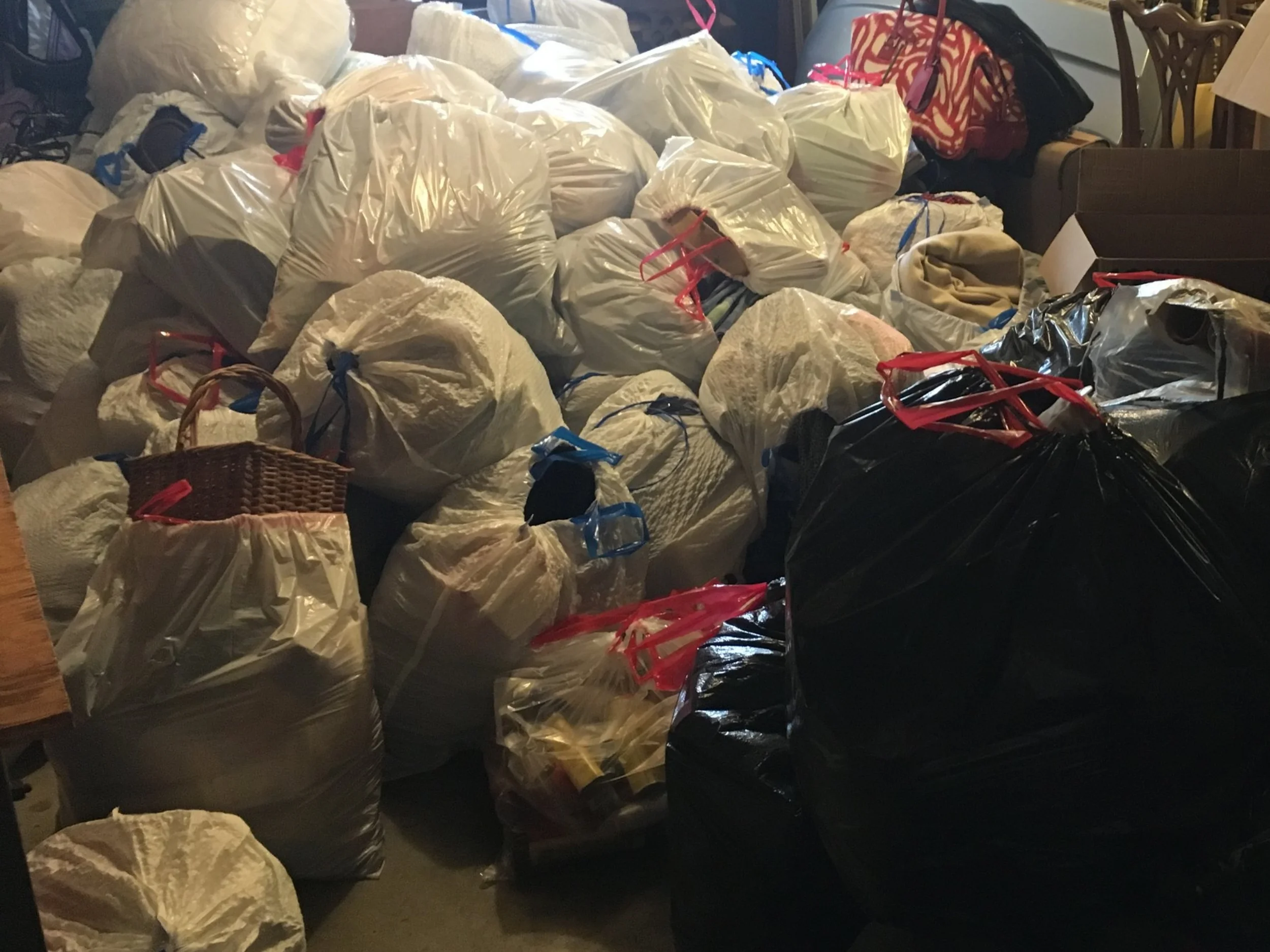 Pile of decluttered belongings to be donated and trashed