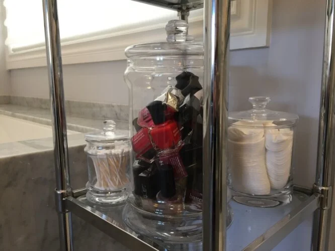 Nail polish stored in a glass canister
