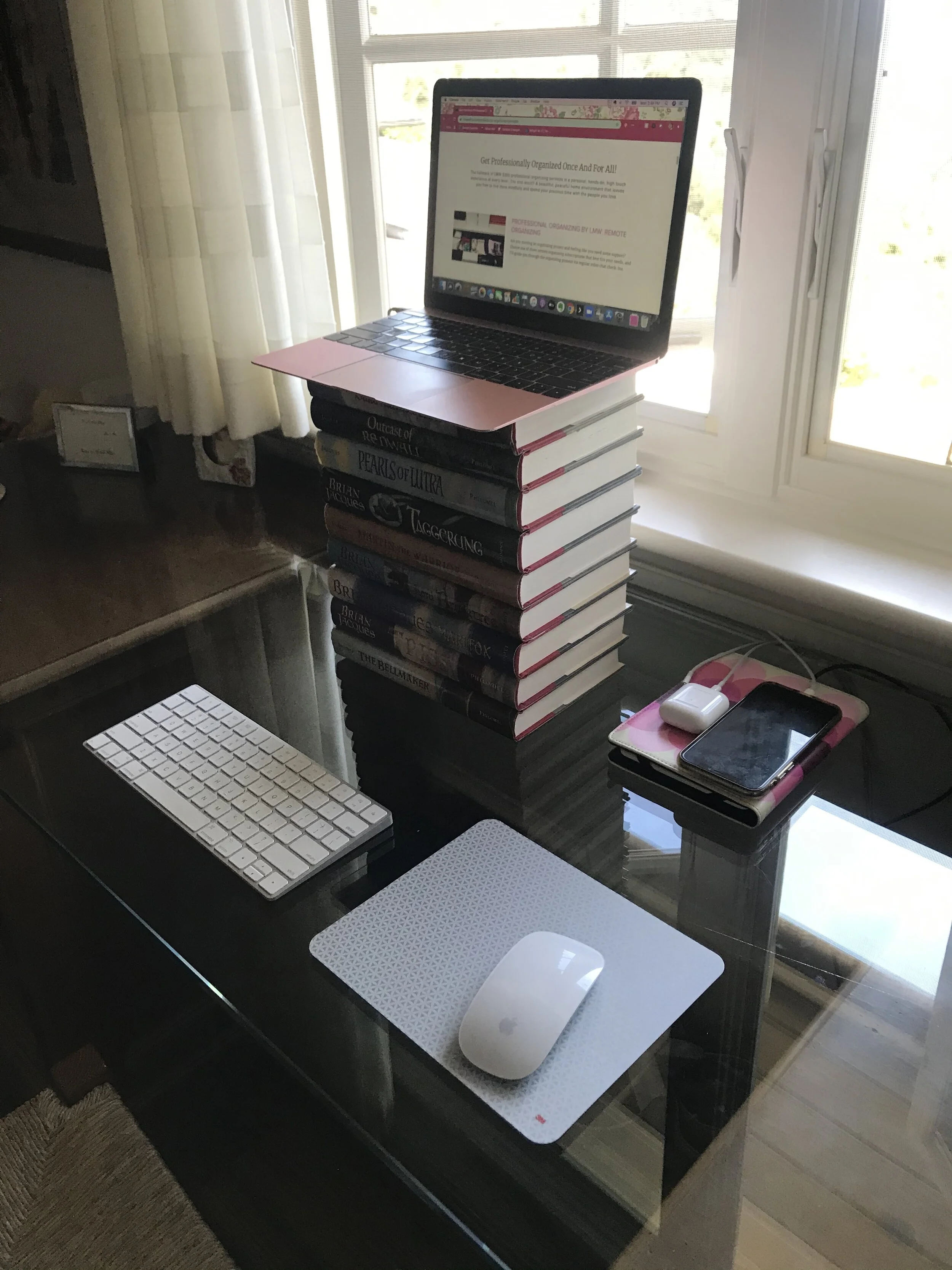 Using books to create an ergonomic desk setup with a laptop