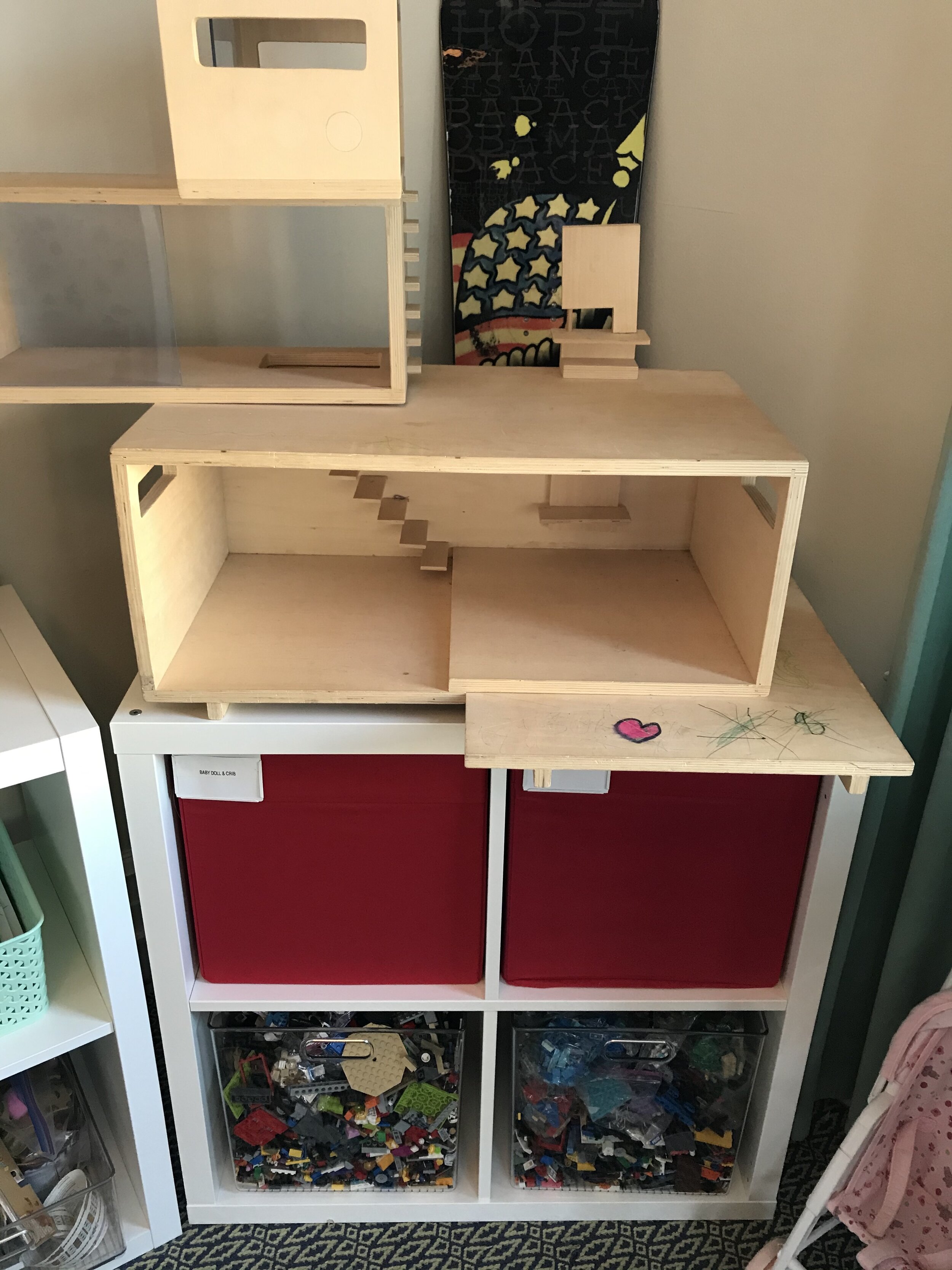 homemade midcentury dollhouse with toy storage