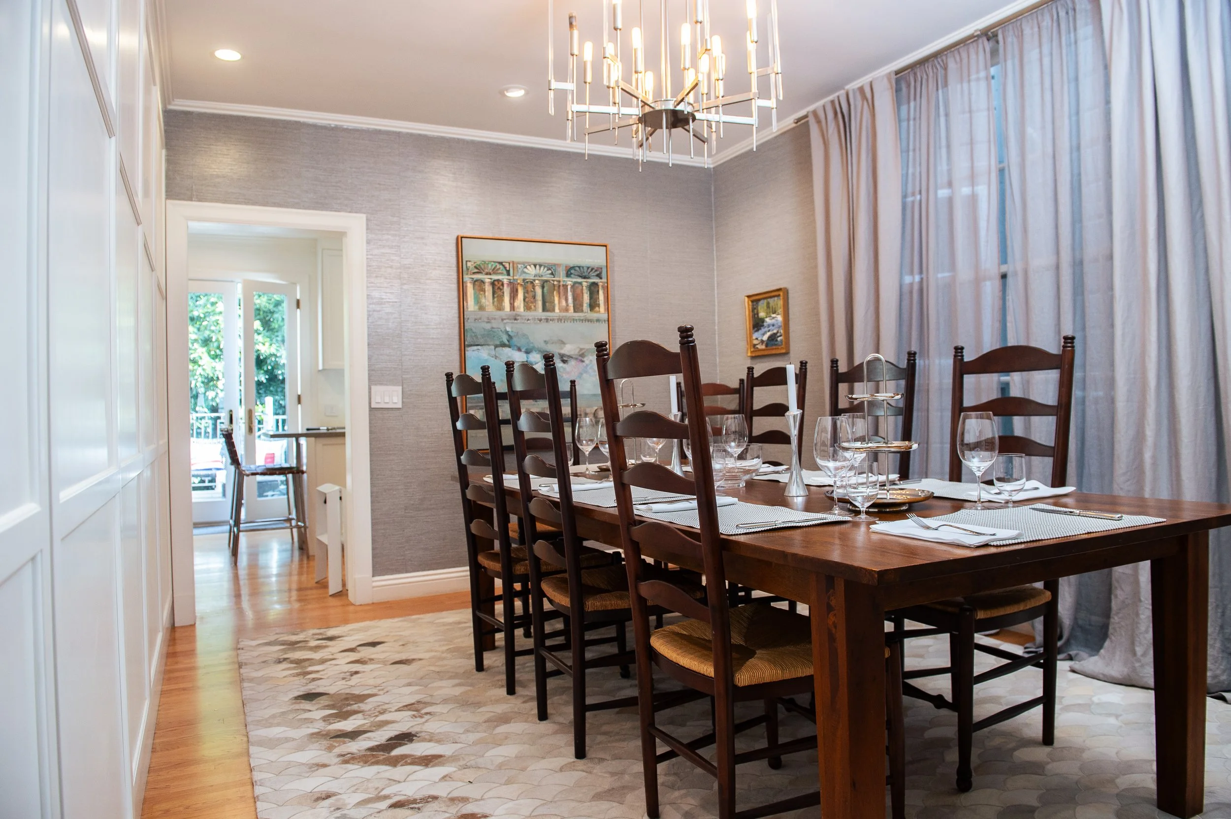 Dining room with a table set for guests in an organized San Francisco home