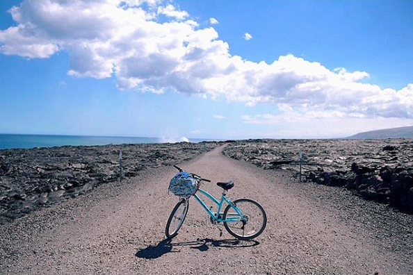 Biking alongside acres and acres of lava ruins... and the smoke behind my bike? That's fresh lava still pouring into the ocean. Hawai'i is too cool 🌋 | Hawaii